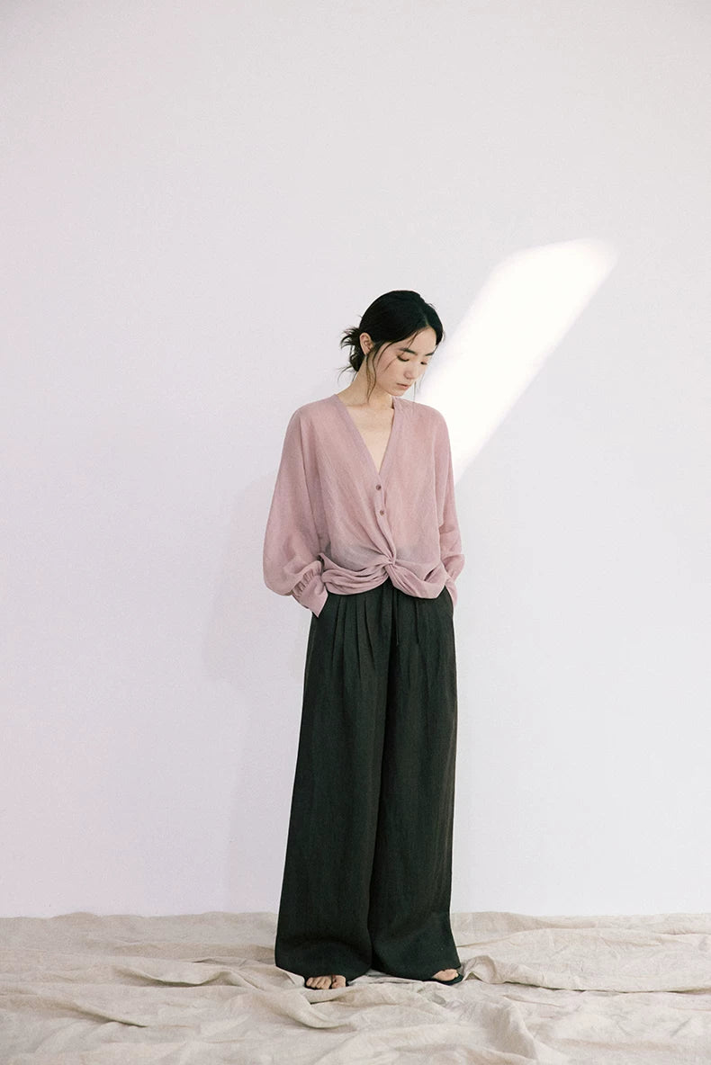 Full outfit view of dusty rose ramie-Tencel blouse with black wide-leg pants