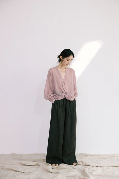 Full outfit view of dusty rose ramie-Tencel blouse with black wide-leg pants
