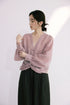 Close-up of dusty rose ramie-Tencel blouse gathered cuff and sleeve detail