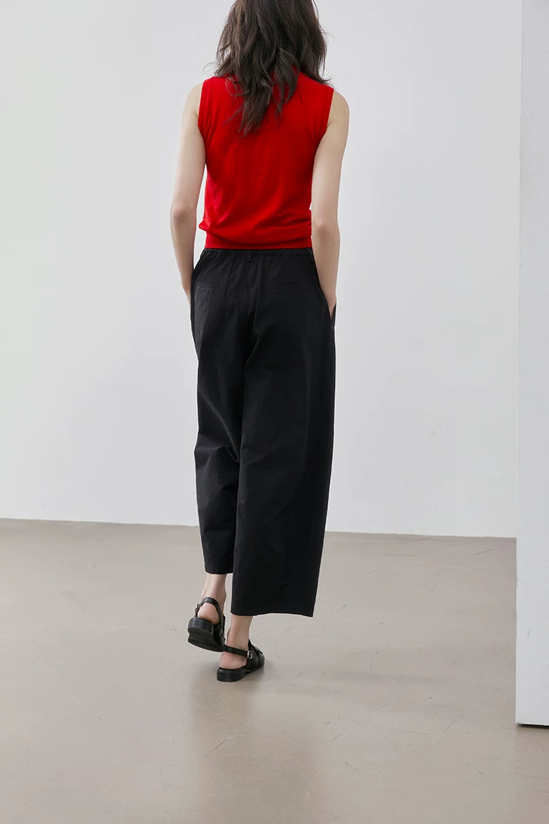 Back view of Red sleeveless wool knit top showing clean back and ribbed hem