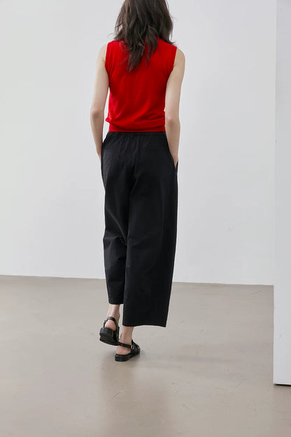 Back view of Red sleeveless wool knit top showing clean back and ribbed hem