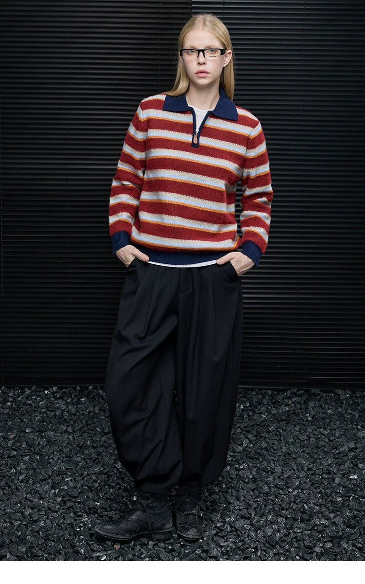 Full-length look of Red Stripe half-zip polo sweater worn with black pleated wide-leg trousers