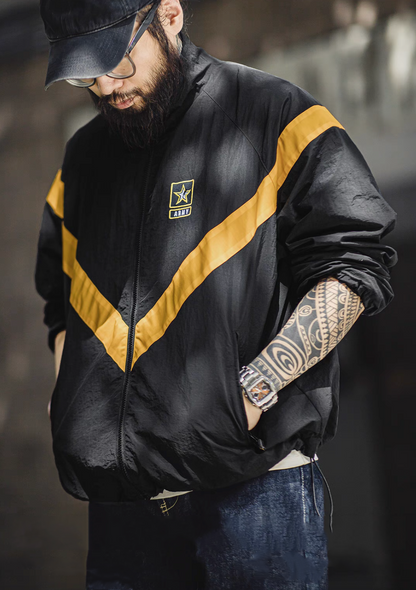 Man wearing Black Reflective V-Stripe Tactical Zip Jacket with hand in pocket highlighting the side zip pocket and lightweight tactical styling