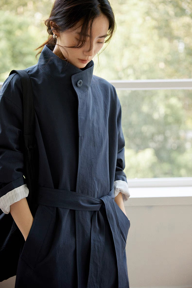 Close-up front view of the blue Relaxed Cotton-Linen Trench highlighting the stand collar, detachable belt, and soft breathable cotton-linen texture
