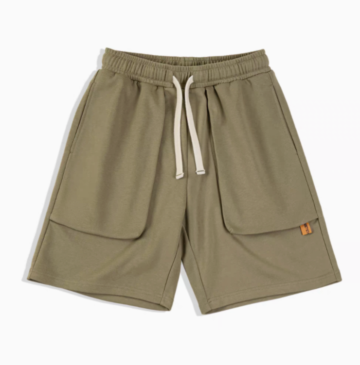 Relaxed Fit Utility Shorts with Deep Pocket Design green front view showing drawstring waist and oversized pockets