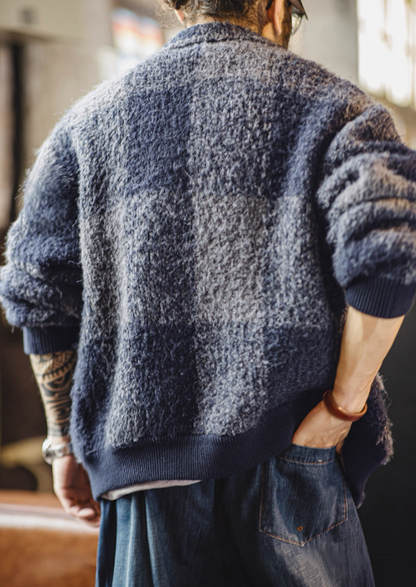 Back view of navy gray plaid boucle jacket showing check pattern.