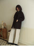 Retro Elegance Oversized Coat in Chocolate Brown front full body view styled with wide leg pants showing relaxed oversized silhouette