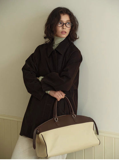 Chocolate Brown Retro Elegance Oversized Coat upper body view styled with handbag highlighting lapel collar and soft suede like texture
