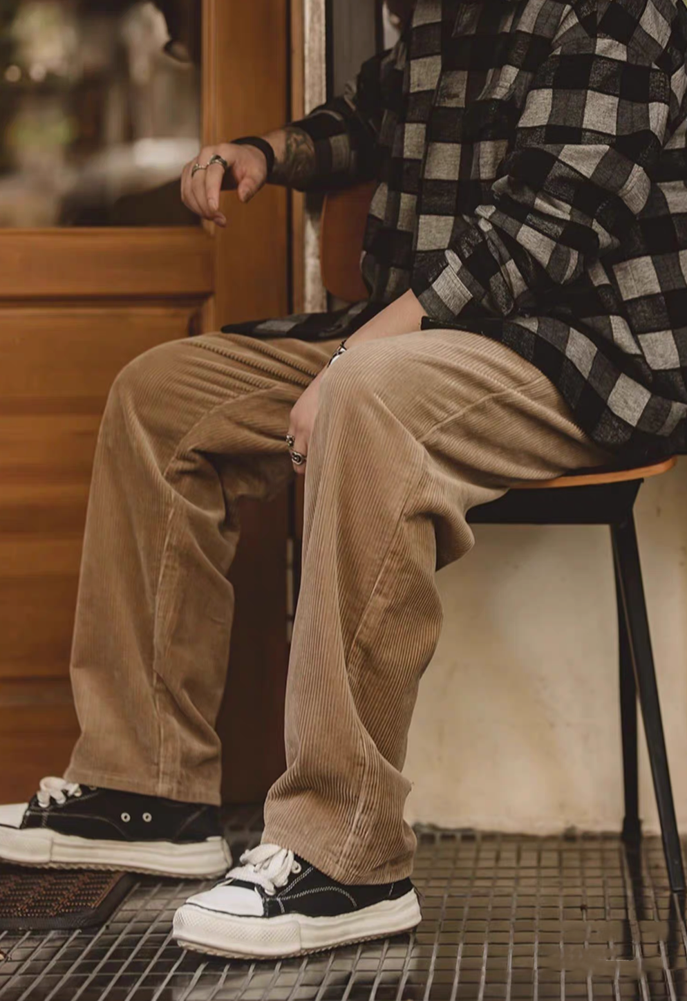 Side view of Retro Grove Cord Pants in Khaki highlighting relaxed fit, soft corduroy fabric, and comfortable straight-leg silhouette while seated