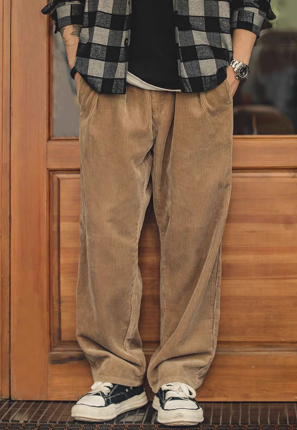 Model wearing Retro Grove Cord Pants in Khaki featuring straight-leg fit, mid-rise waist, and classic corduroy texture in casual everyday look
