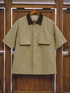 Retro waterproof utility shirt in khaki green front view with button closure dual chest patch pockets and corduroy collar