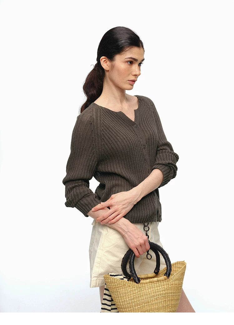 Olive brown ribbed V-neck raglan cardigan, side view with bag