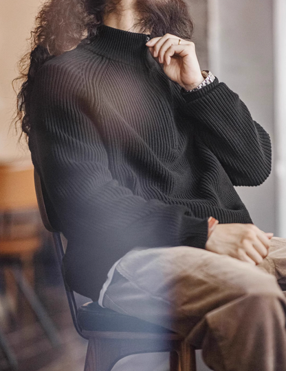 Seated view of Ridge Half-Zip Pullover Sweater in Charcoal Black showing adjustable half-zip collar ribbed texture and comfortable everyday fit