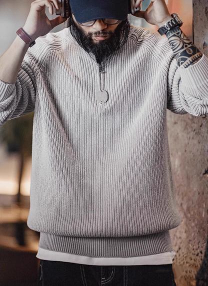 Man wearing Ridge Half-Zip Pullover Sweater in Smoky Gray adjusting headphones showcasing casual comfort ribbed knit fabric and modern fit