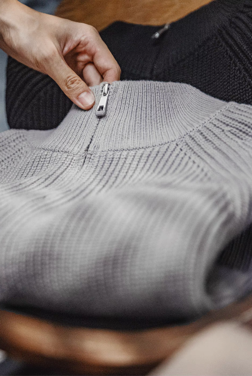 Close up of Ridge Half-Zip Pullover Sweater in Smoky Gray highlighting metal zipper ribbed collar construction and soft mid-weight knit fabric