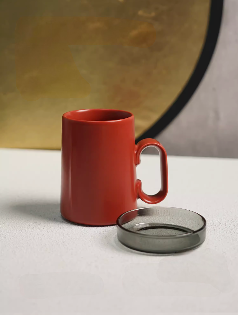 Red Ringmug ceramic mug with lid placed beside the mug, front view showing ring handle design and smooth glazed finish