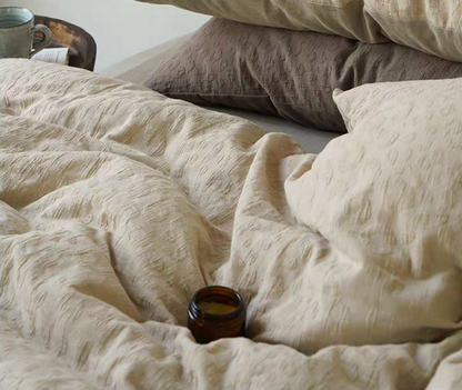Leopard Print Almond Yellow cotton comforter and sheet set from Rock Point bedding collection shown on bed