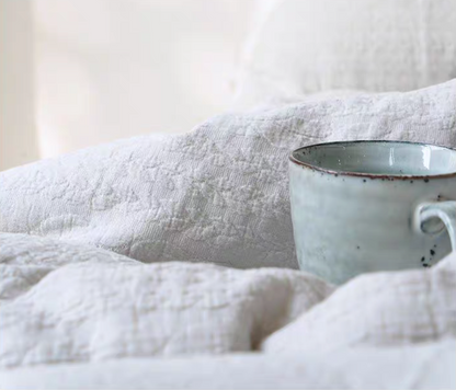 Close-up of Rock Point white cotton bedding showing soft breathable textured cotton fabric