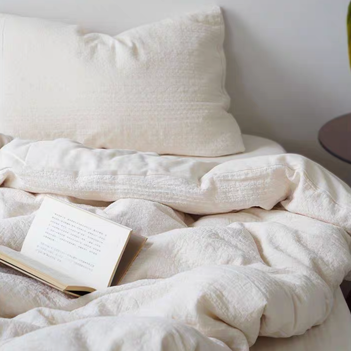 Rock Point cream cotton comforter draped across bed showing soft breathable cotton bedding layers