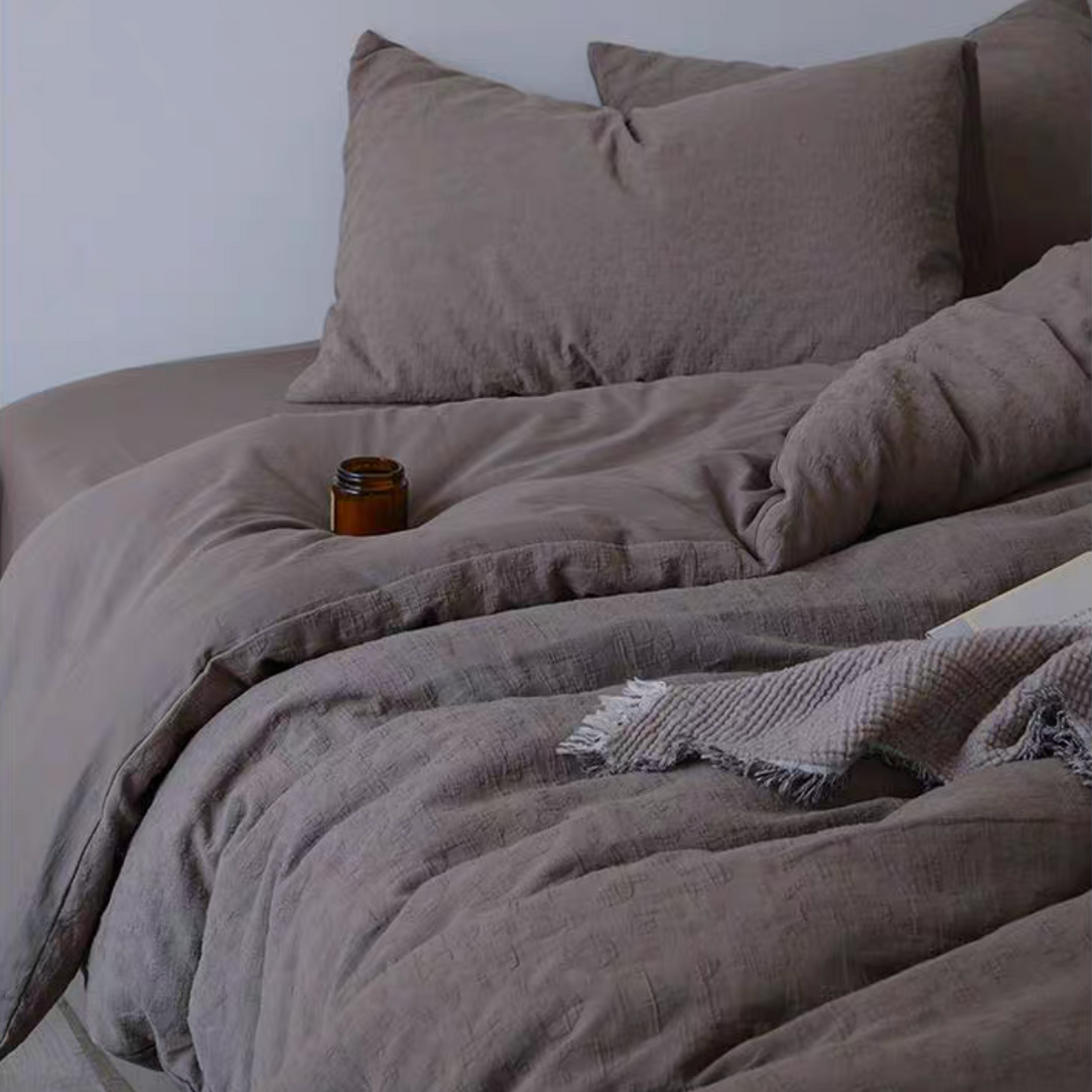 Rock Point cotton comforter, sheet and shams set in Leopard Print Coconut Brown styled on bed with natural textured cotton bedding