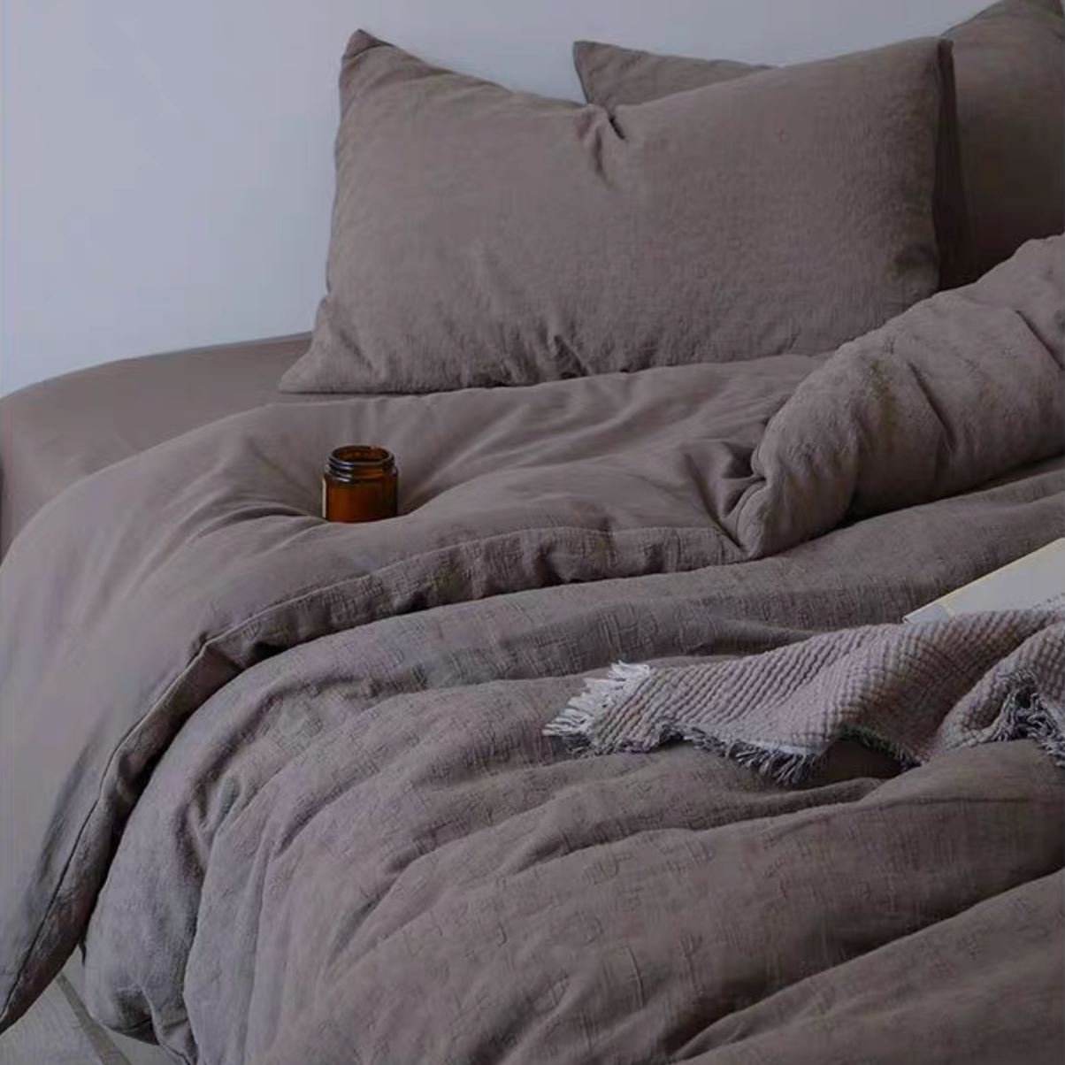 Rock Point cotton comforter, sheet and shams set in Leopard Print Coconut Brown styled on bed with natural textured cotton bedding
