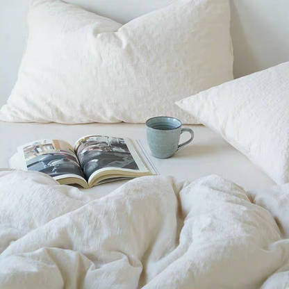 Rock Point cotton comforter, sheet and shams set in Leopard Print Cream styled on bright minimalist bedroom bed