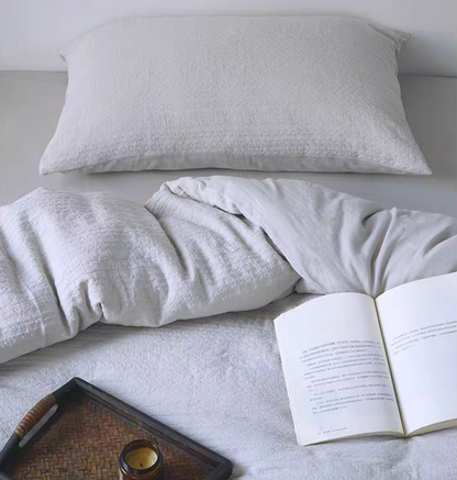 Rock Point cotton comforter, sheet and shams set in white styled on bed with soft textured cotton bedding