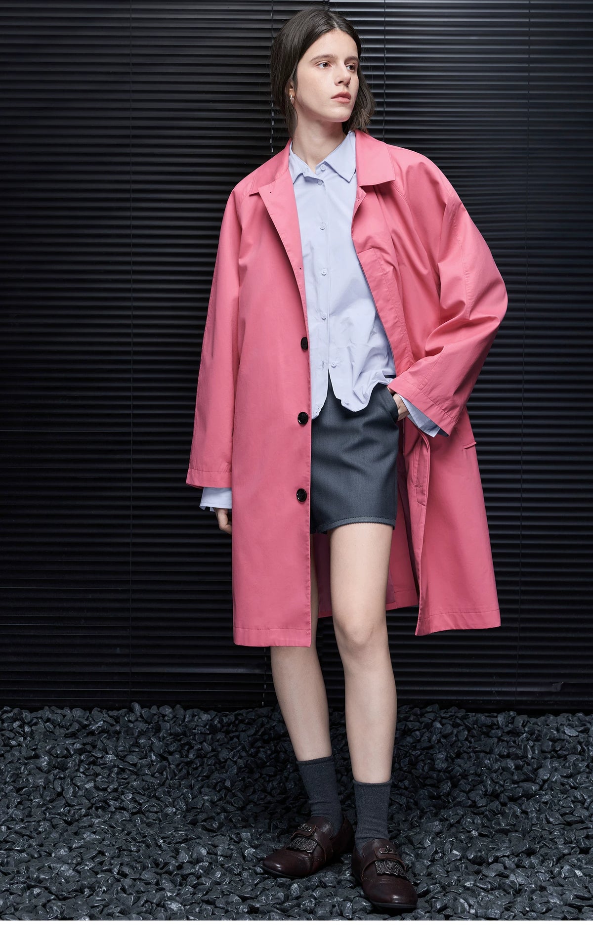Rose Pink knee-length trench coat worn open, showing black round buttons and the chest pocket