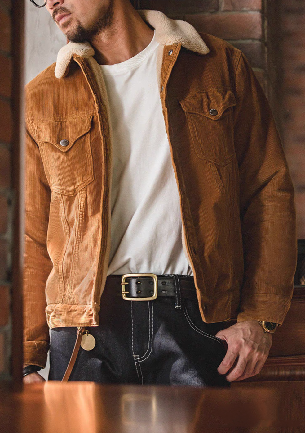 Man wearing Rust Corduroy Trucker Jacket with Sherpa Collar in Ginger Yellow styled open showing sherpa collar and chest pockets