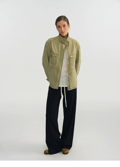 Full-length front view of a sage green relaxed-fit field jacket