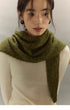 woman wearing moss green knit cashmere wool scarf wrapped around neck