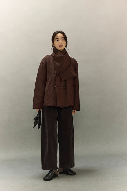 Full length look of minimalist dark coffee brown scarf puffer styled with wide-leg pants