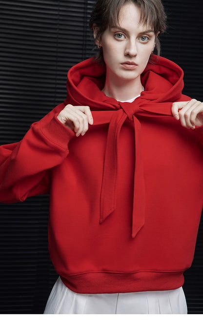 Close-up of Scarlet Red heavyweight hoodie with neck ribbons tied into a bow