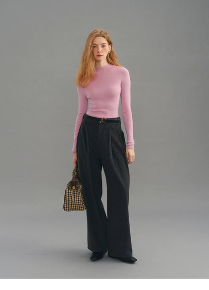 Dusty pink seamless wool sweater, full body front view with bag