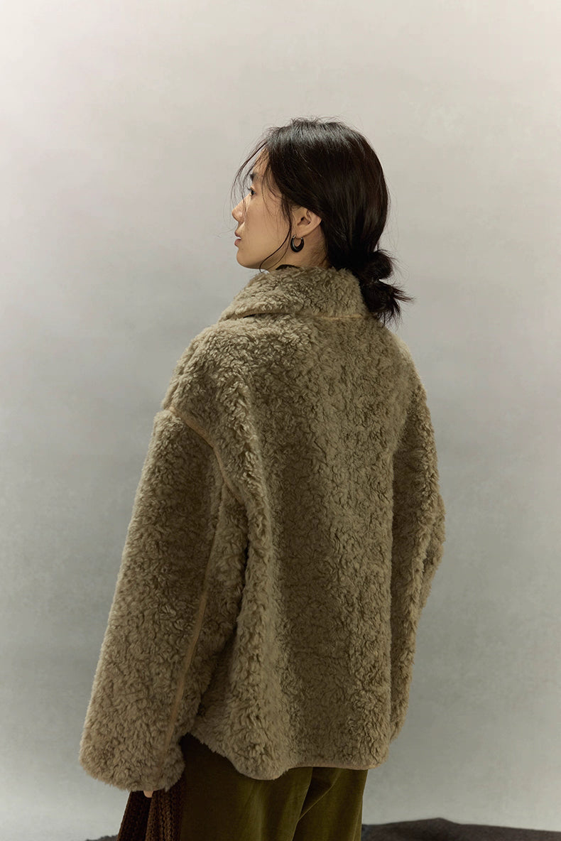 Back view of short sherpa wool jacket showing relaxed silhouette