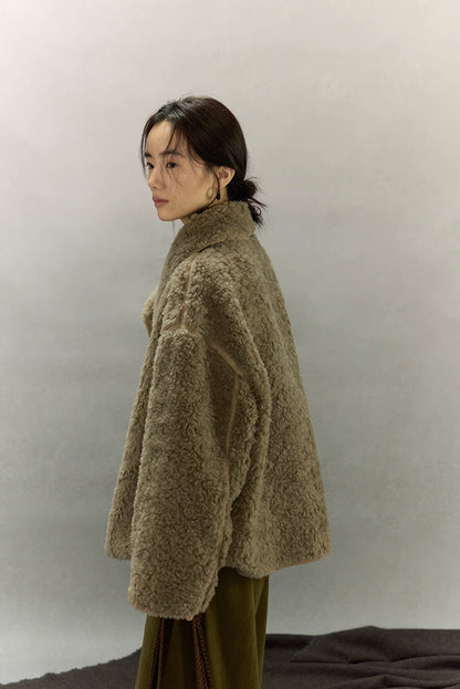 Side profile of sherpa wool jacket highlighting dropped shoulders