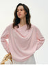 Close-up of pink silk top draped cowl neckline detail