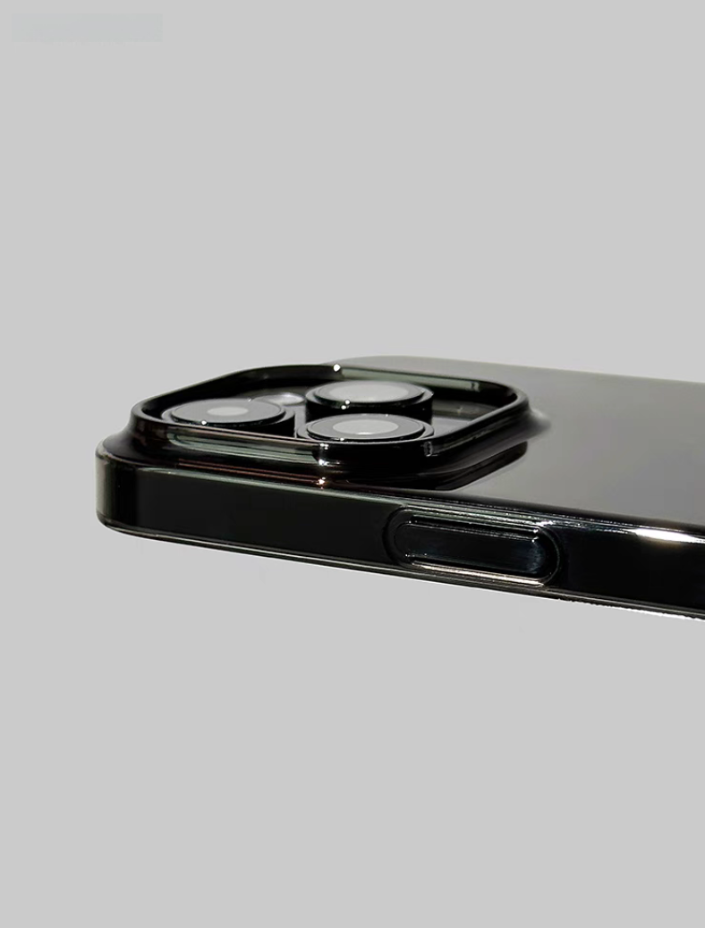 Clear black phone case close up showing raised camera protection edge and side button design