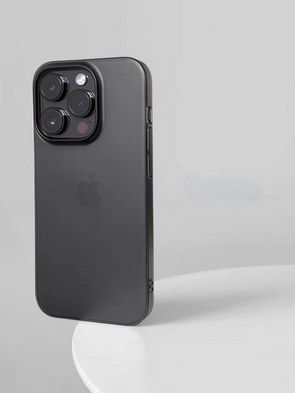 Matte black phone case on iPhone standing upright with smooth dark finish and minimalist style