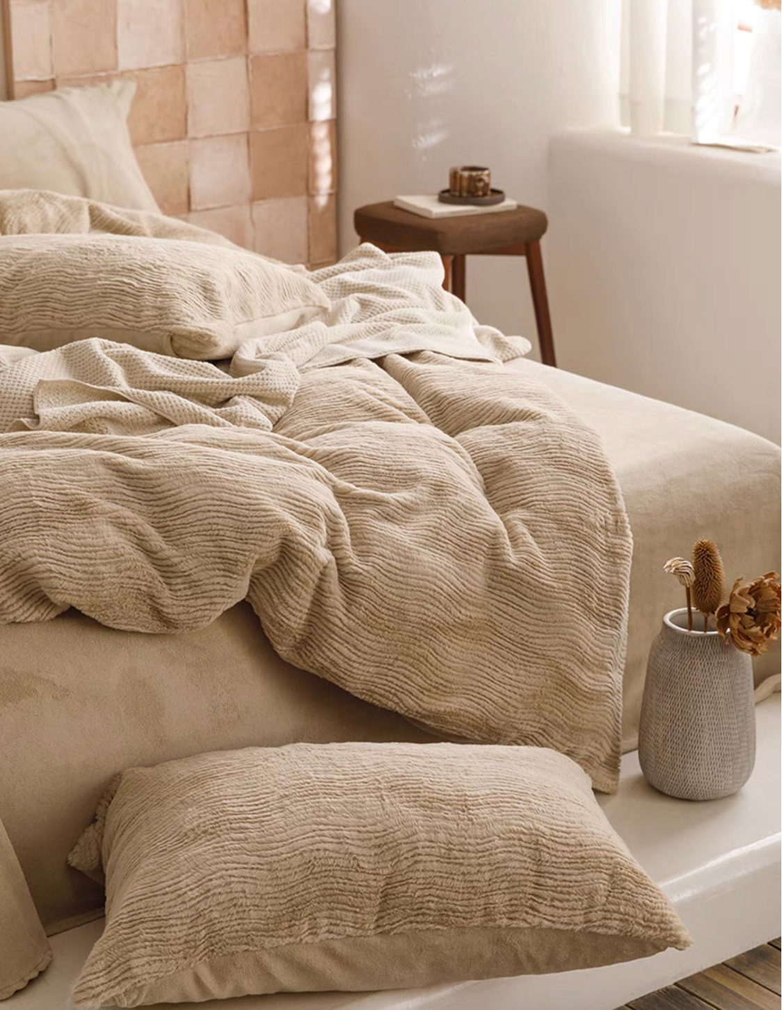 Coffee SnowRabbit plush fur duvet cover and sheet set draped across bed with matching textured pillow and bedside decor