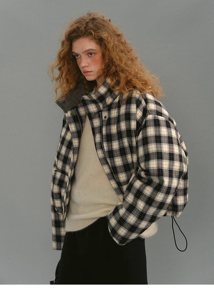 Three-quarter side view of the SoftGrid wool check puffer highlighting the cropped boxy fit and relaxed shoulders.