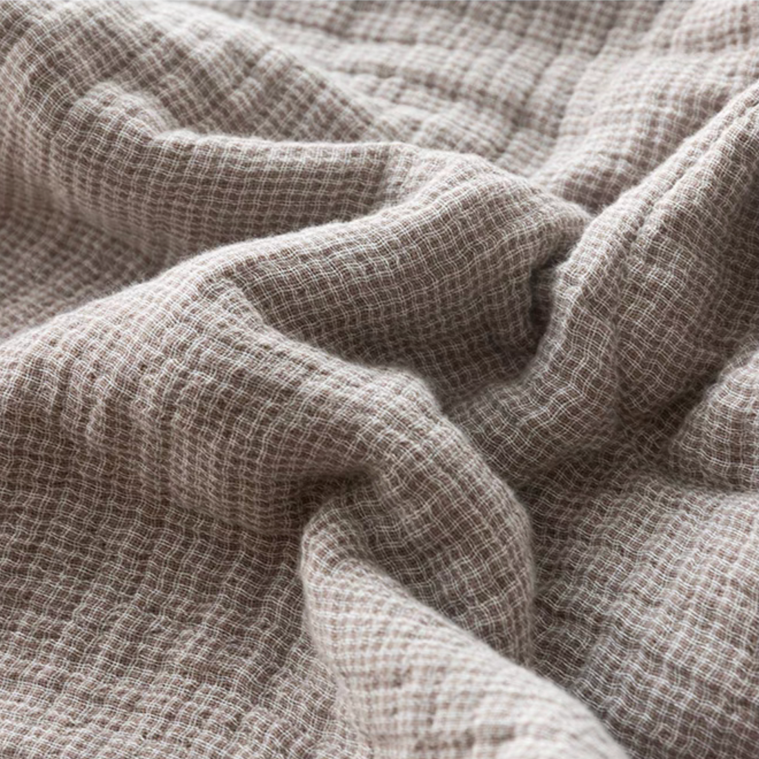 Close-up of SoftNest cotton muslin bedding set fabric in Beige Coffee Stripes showing soft breathable triple-layer muslin texture