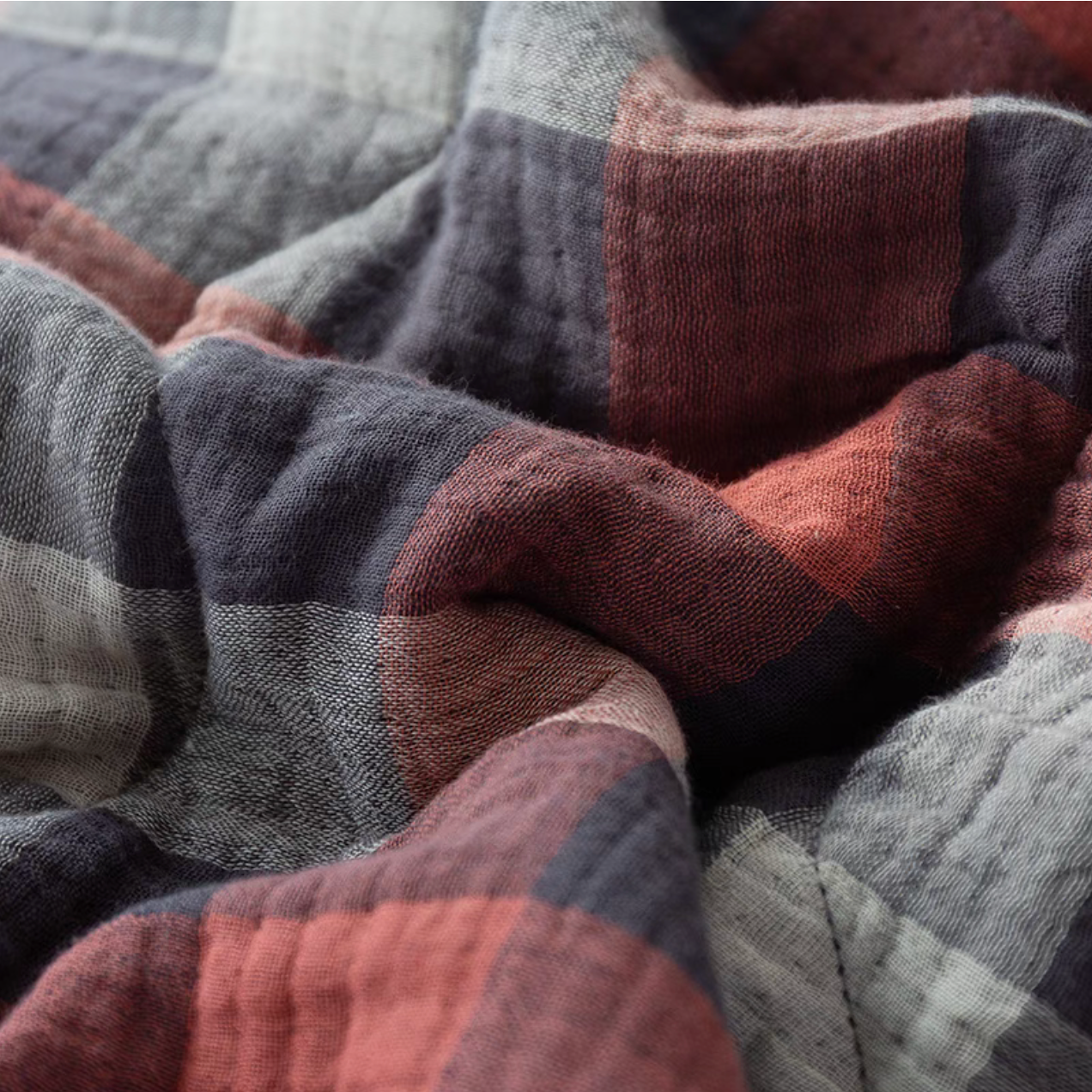 Close-up of Red Black Stripes cotton muslin fabric showing breathable triple-layer weave texture