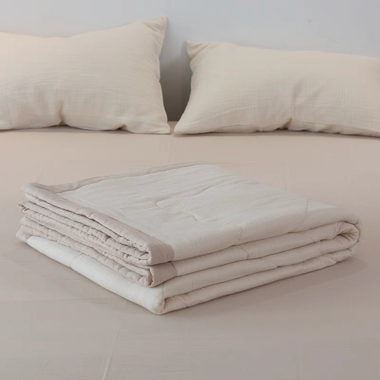 Folded Light Yellow SoftNest cotton muslin quilt showing breathable soft triple-layer cotton muslin fabric