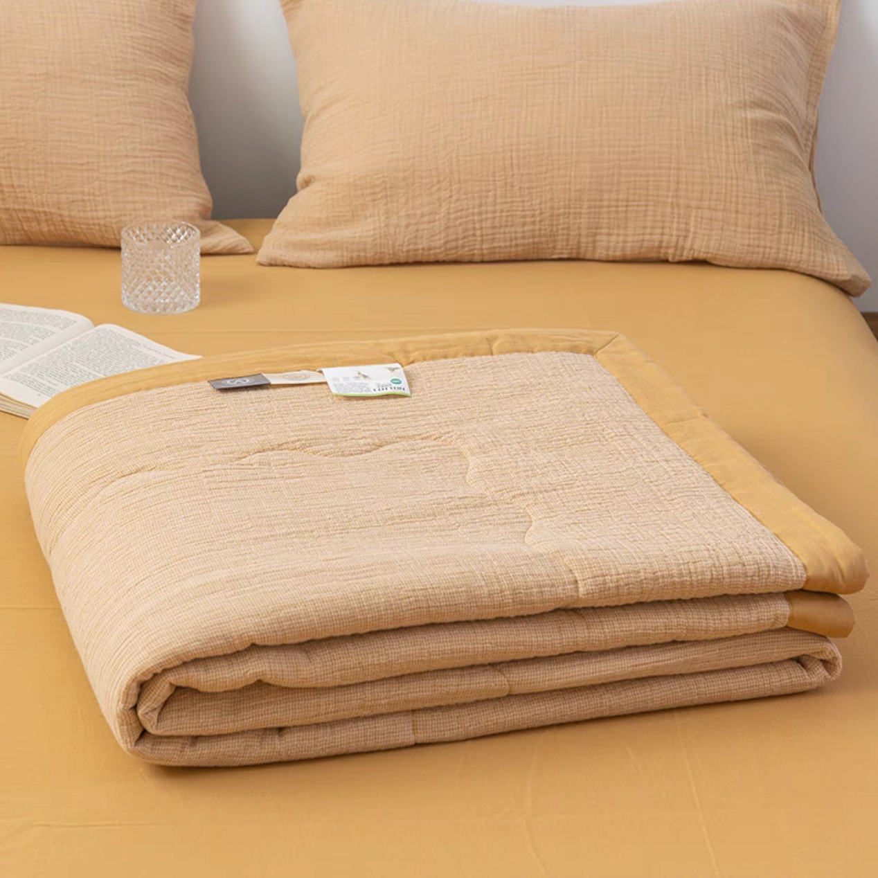 Folded Mustard Yellow SoftNest cotton muslin quilt highlighting soft breathable layered muslin fabric