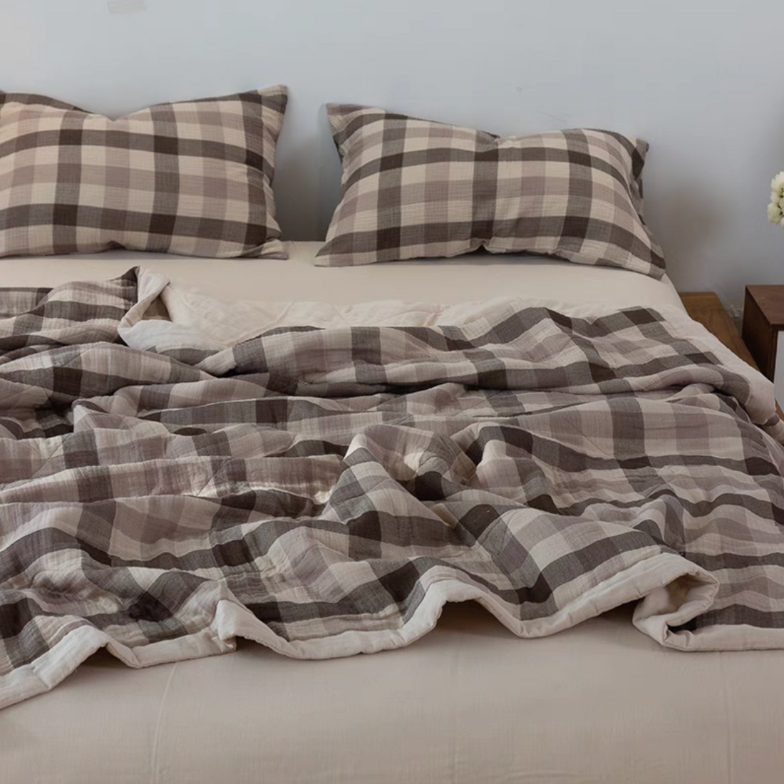 SoftNest triple-layer cotton muslin bedding set in Beige Coffee Stripes draped across bed with matching pillow shams