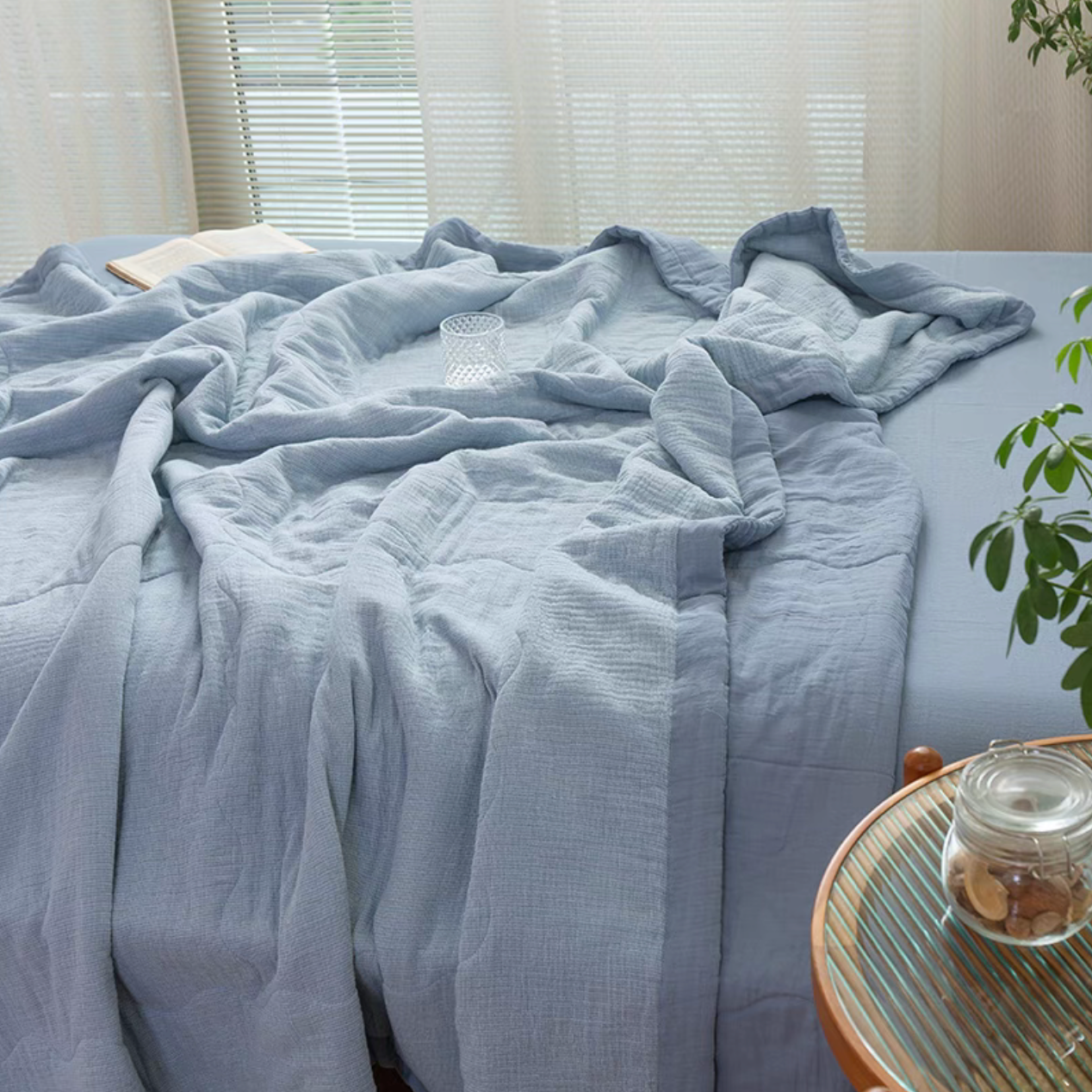 Light Blue SoftNest triple-layer cotton muslin bedding set draped naturally across bed creating soft breathable bedroom comfort