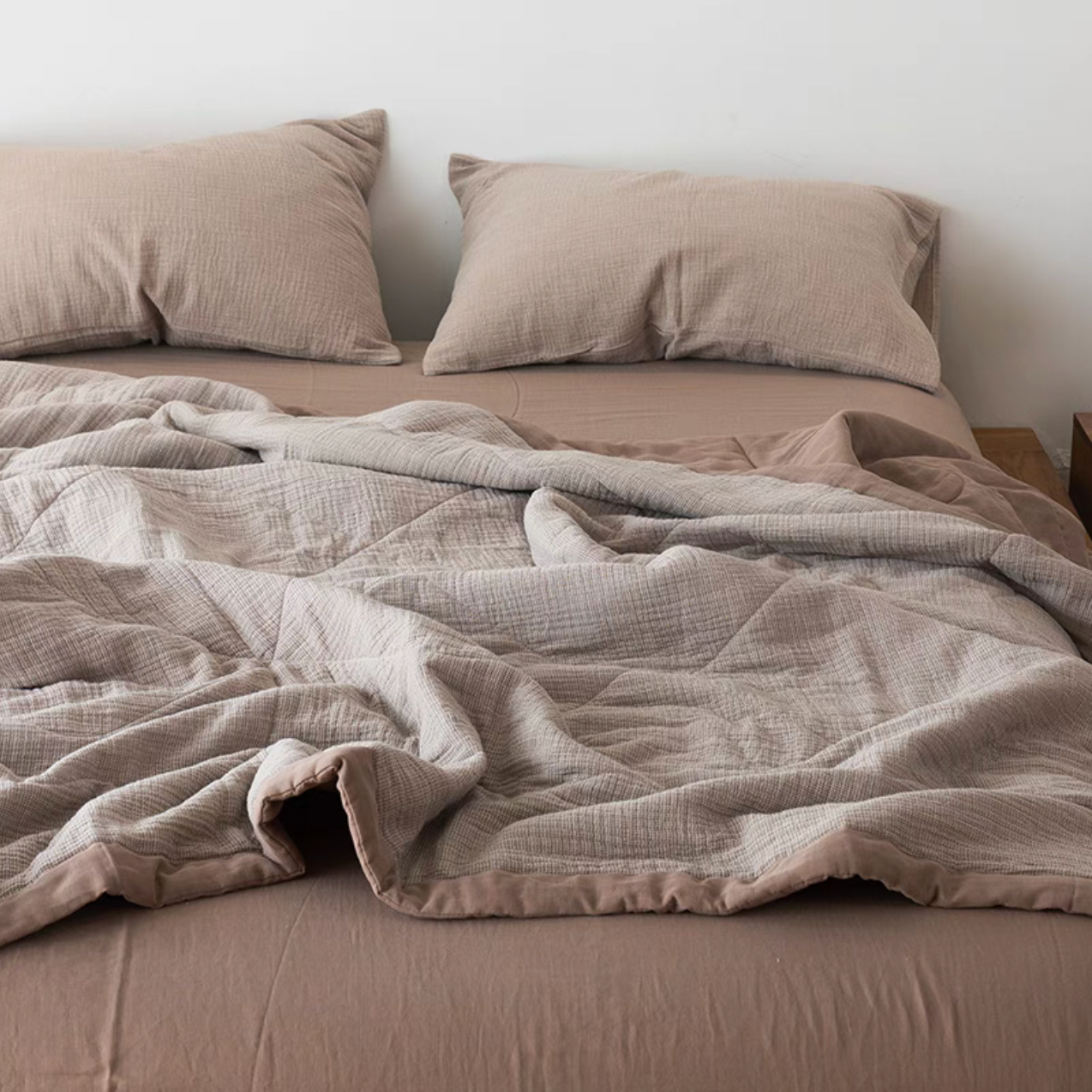 SoftNest triple-layer cotton muslin bedding set in Coffee color spread across bed with matching muslin pillowcases