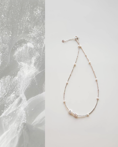 Spaced Baroque and Freshwater Pearl Sterling Silver Choker flat lay with delicate silver chain and asymmetrical pearl accents