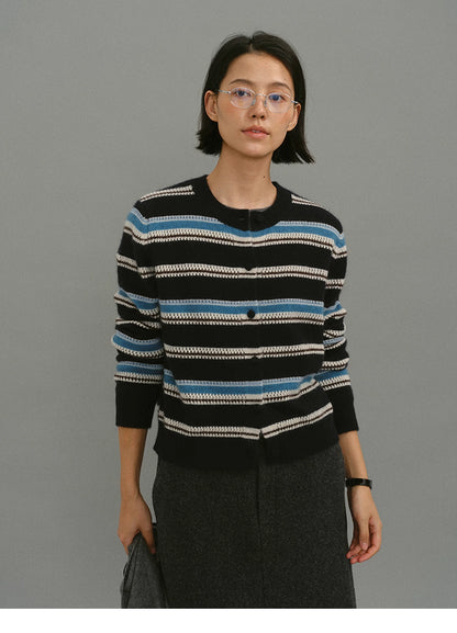 Front portrait of the black-blue striped wool-blend cardigan, showing crew neckline and button-front closure.